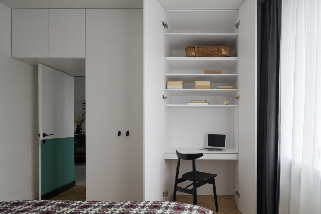 Functional idea with small desk to work in white wardrobe in spacious bedroom