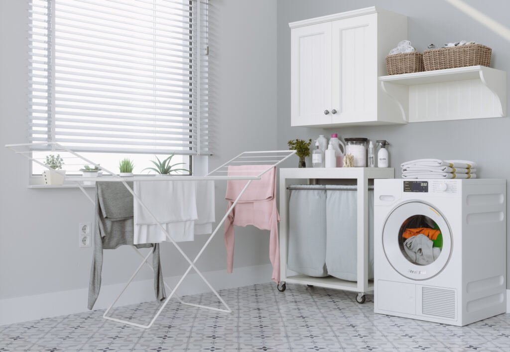 Modern Laundry Room With Washing Machine, White Cabinets And Drying Rack
